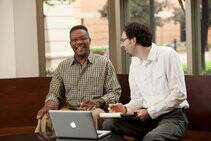 Researcher helping a participant complete a survey